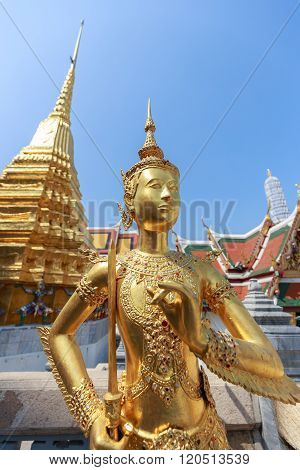 Gold Statue Of Human Half Bird