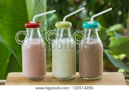 Strawberry, Chocolate And Fresh Milk Bottles