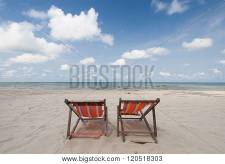 Beach chairs on perfect tropical white sand beach
