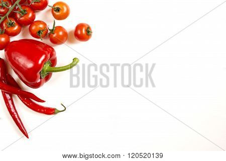 Tomatoes red pepper  on a white white background free space top view