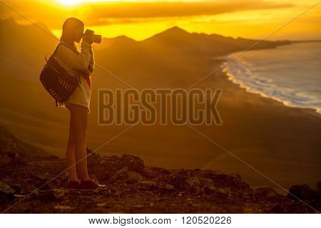 Woman photographing Fuerteventura island