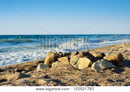 Boulders On The Beach, Against Tidal Bore Of The Sea