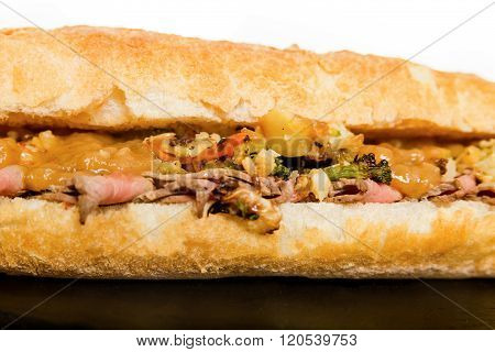Close Up Of Italian Sub Long Baguette With Ham Cheese Tomato And Lettuce
