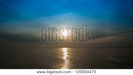Dawn over the  Sea, Sunrays in the sky.