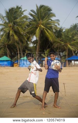 AGONDA, INDIA - OCTOBER 13, 2015: Unidentified children at Agonda beach at Goa India. This 3 km beach in South Goa is famous as a Ridley turtle nesting site.