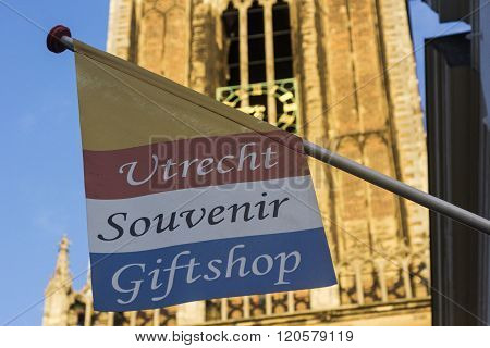 UTRECHT, UTRECHT, NETHERLANDS - OCTOBER 22, 2014: Gift shop in Utrecht in Holland with St. Martin's Cathedral in the background