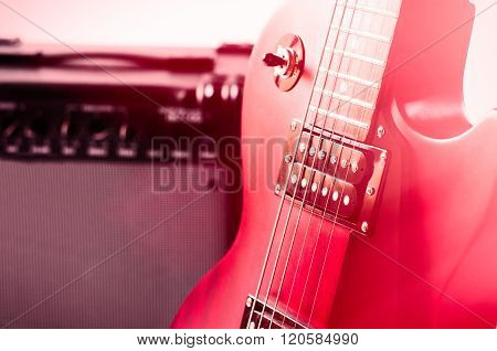Part of electric guitar on wooden background. Old style.
** Note: Shallow depth of field