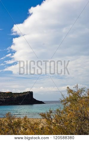 Cliffs at the end of sandy beach in San Pietro island, Sardinia