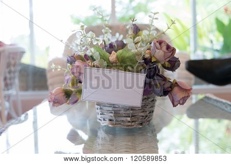 White Paper Blank On Flowers Vase Decorated In Living Room