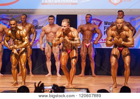 Male Bodybuilders Flex Their Muscles To Show Their Physique