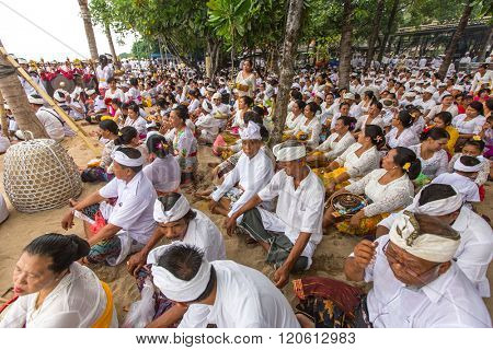 SANUR, BALI - MAR 18, 2016: Unidentified local people during ceremony Melasti Ritual. Melasti is a Hindu Balinese purification ceremony and one of the most important rituals of Bali island. 