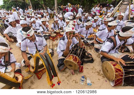 SANUR, BALI - MAR 18, 2016: Unidentified local people during ceremony Melasti Ritual. Melasti is a Hindu Balinese purification ceremony and one of the most important rituals of Bali island. 