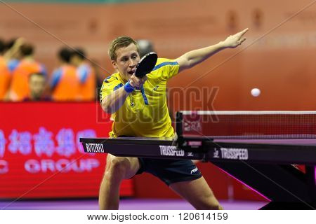 KUALA LUMPUR, MALAYSIA - MARCH 01, 2016: Mattias Karlsson of Sweden plays a return shot in his match in the Perfect 2016 World Team Table-tennis Championships held in Kuala Lumpur, Malaysia.