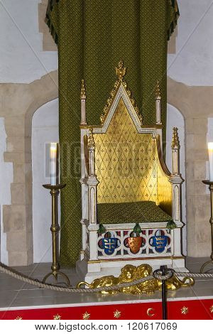 LONDON UK - JUNE 6 2015: Throne of Henry III and his son Edward I in Wakefield tower at Tower of London. The throne is based upon one actually made for Edward I which still survives in Westminster abbey.