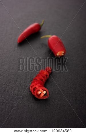 Chili pepper on black stone