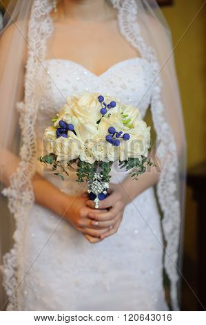 Wedding flowers ,Woman holding colorful bouquet with her hands on wedding day