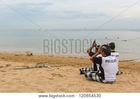 SANUR, BALI - MAR 18, 2016: Unidentified local people during ceremony Melasti Ritual. Melasti is a Hindu Balinese purification ceremony and one of the most important rituals of Bali island. 