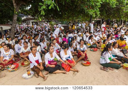 SANUR, BALI - MAR 18, 2016: Unidentified local people during ceremony Melasti Ritual. Melasti is a Hindu Balinese purification ceremony and one of the most important rituals of Bali island. 