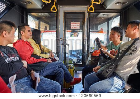 PATTAYA, THAILAND - FEBRUARY 26, 2016: passengers in the bus at U-Tapao International Airport. U-Tapao Rayong -Pattaya International Airport is serving Rayong and Pattaya cities in Thailand.