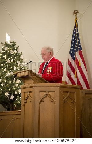 SUCCASUNNA, NJ-DEC 12, 2015: Opening remarks by Robert Beck, Commandant of L/Cpl Robert J Slattery Detachment U.S. Marine Corps League at the memorial service for 2015 Wreaths Across America event.