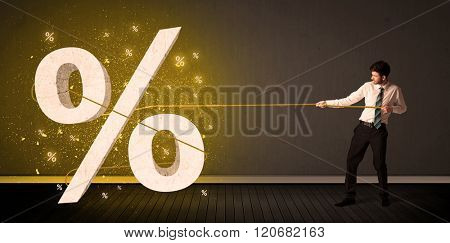 Business man pulling rope with big procent symbol sign concept on background