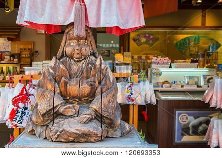 MIE JAPAN - NOVEMBER 20 2015: Wood sculpture of Japanese priestess at Oharai-machi is the old-800 meter long pilgrimage road that leads to Ise Jingu inner shrine with traditional Edo architecture style
