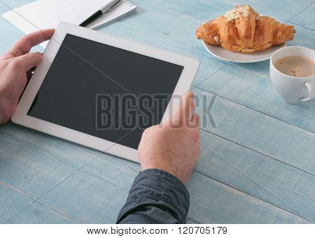 Man Holding Tablet Computer With A Blank Screen