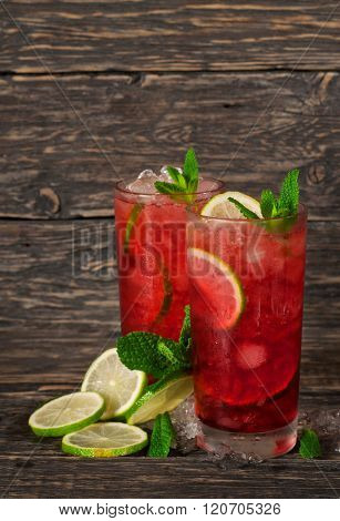 Red Cocktail With Mint, Lime And Ice