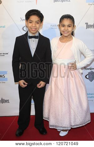 MALIBU - MAR 5: Kevin Tellez, Gaby Palacio at the Children International Charity's 'Share The Love Around The World' Fundraiser at Rocky Oaks Malibu on March 5, 2016 in Malibu, California