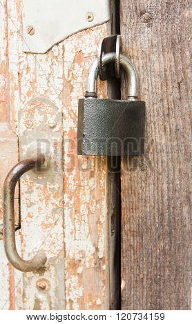 Hanging Lock On An Old Wooden Door