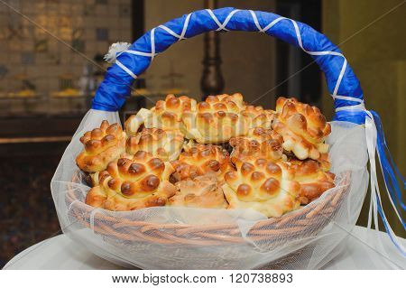 Traditional tasty ukrainian wedding bread loaf  and buns for guests as a gift at the wedding.