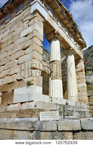 Building of Treasury of Athens in Ancient Greek archaeological site of Delphi, Greece