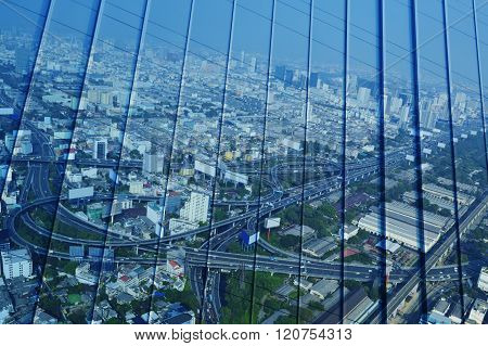 Reflect Of Aerial View Of Cityscape Expressway And Highway On Metal Wall, Blue Tone, Bangkok Thailan