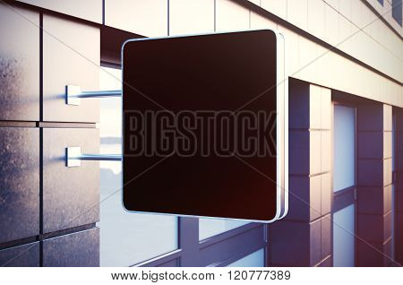 Black empty chalk board on the bulding city. Concrete facades of modern buildings in background. Hor
