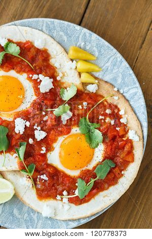 Closeup Of Huevos Rancheros With Sliced Avocado