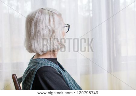Old Lady Looking At Her Window