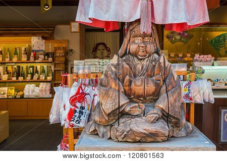 MIE JAPAN - NOVEMBER 20 2015: Wood sculpture of Japanese priestess at Oharai-machi is the old-800 meter long pilgrimage road that leads to Ise Jingu inner shrine with traditional Edo architecture style
