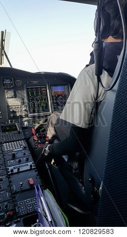 Pilot and copilot in corporate plane in cockpit, Pilot operation with control panel.