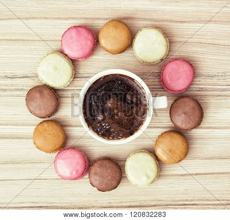 Cup Of Black Coffee With French Macarons