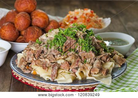 National Kazakh Dishes: Beshbarmak, Salad Of Radish Shalgam, And Baursak.