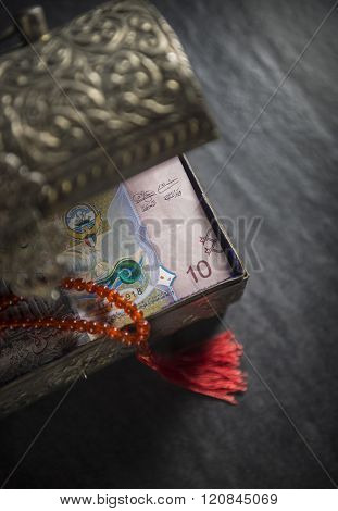 Close up of KWD 10 note from a vintage trunk. Shariah compliant finance. Kuwaiti Dinar currency.