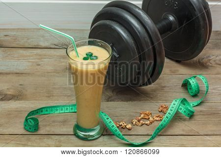 Fruit Smoothies And A Dumbbell In The Background
