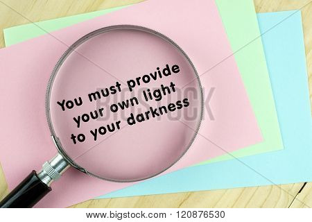 Magnifying glass on papers with inspirational words