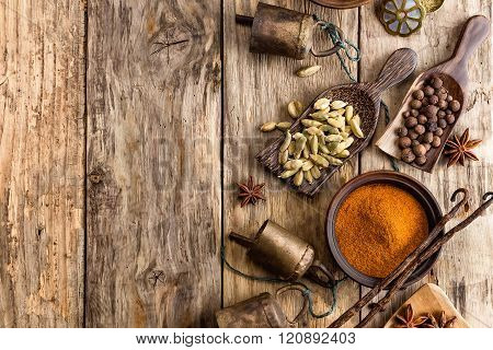 various spices on wooden background
