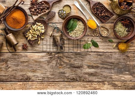 various spices on wooden background