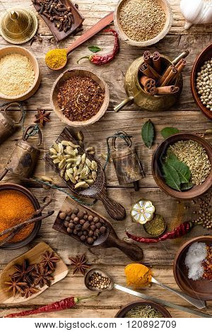 various spices on wooden background