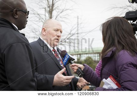 MAR 5 2016 - WOODBRIDGE, NJ: SMART TD General Chairperson Stephen Burkert spokesman for the NJ Transit Rail Labor Coalition representing 11 employee unions speaks to PIX 11 News reporter at the rally.