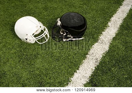 Black and white football helmets