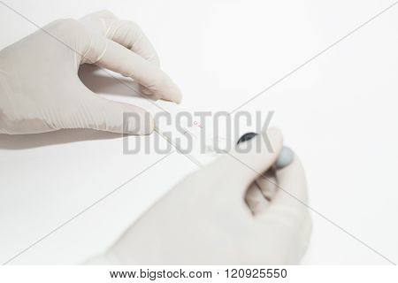 Hand scientist working in laboratory blood slide