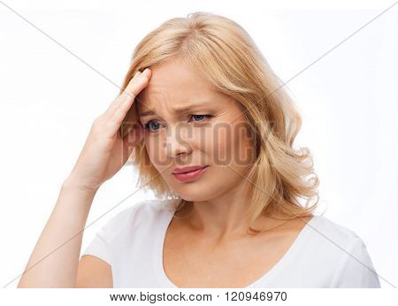 people, healthcare, stress and problem concept - unhappy woman suffering from headache